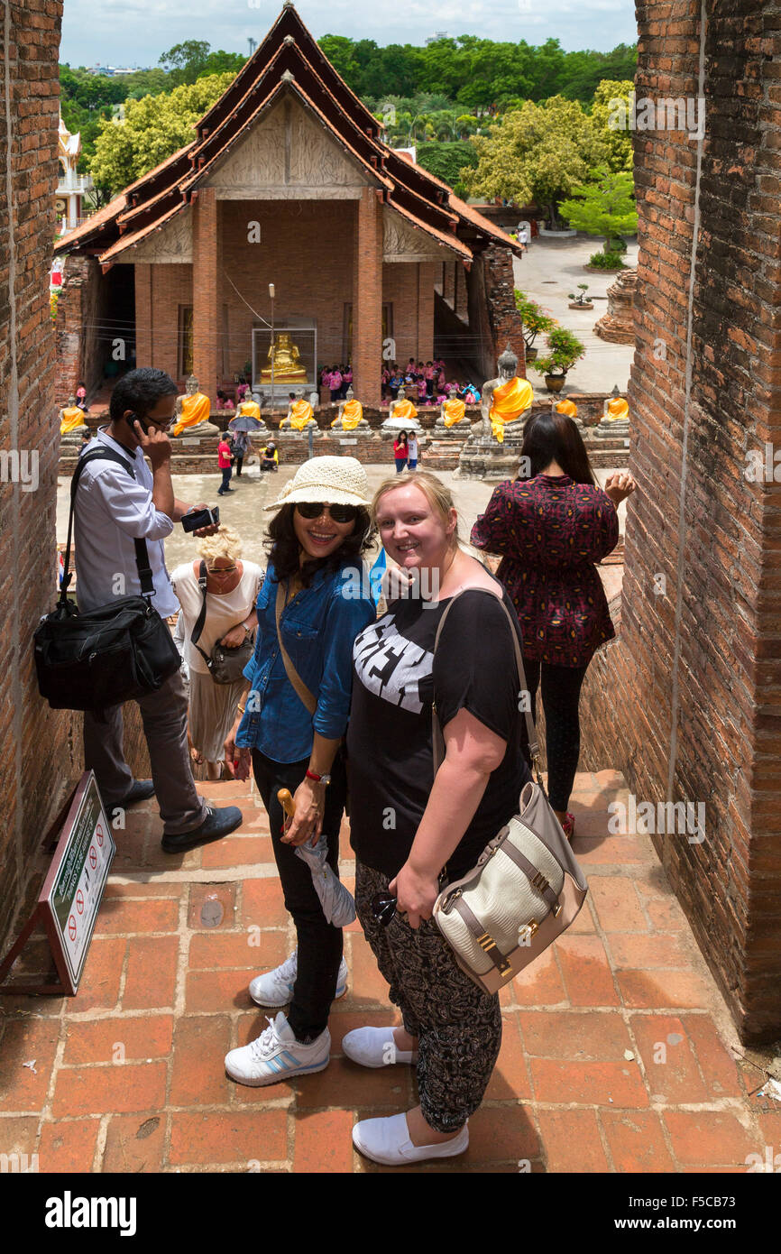 Tourists at Yai Chai Mongkhon temple, Ayutthaya, Thailand Stock Photo