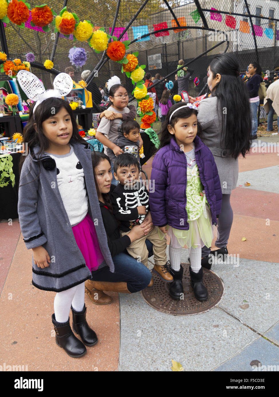 Children pose for photos at Day of the Dead Festival in Brooklyn, NY, Nov.1, 2015. Stock Photo