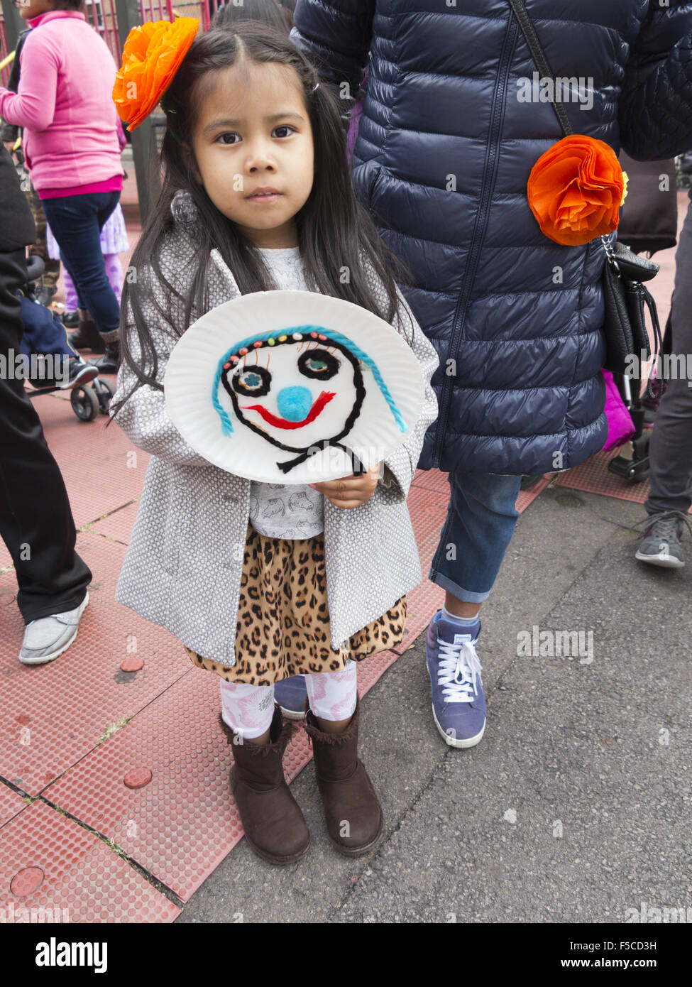 Day of the Dead Festival in the Kensington section of Brooklyn, NY, Nov.1, 2015. Young girl displays picture she made. Stock Photo