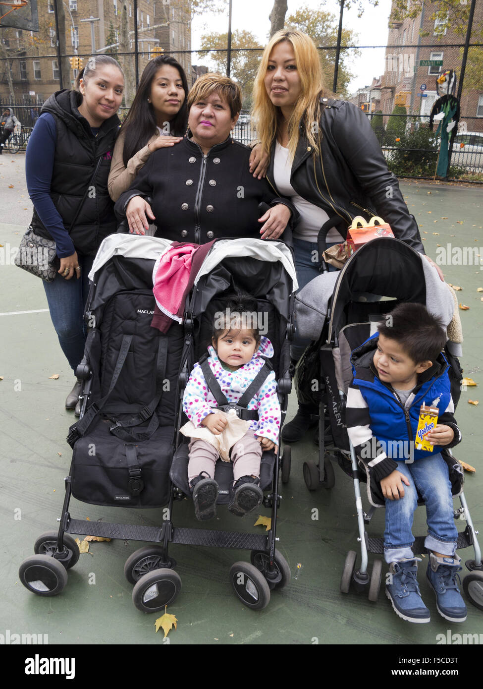 Three generations of a Mexican family at Day of the Dead Festival in Brooklyn, NY, Nov.1, 2015. Stock Photo