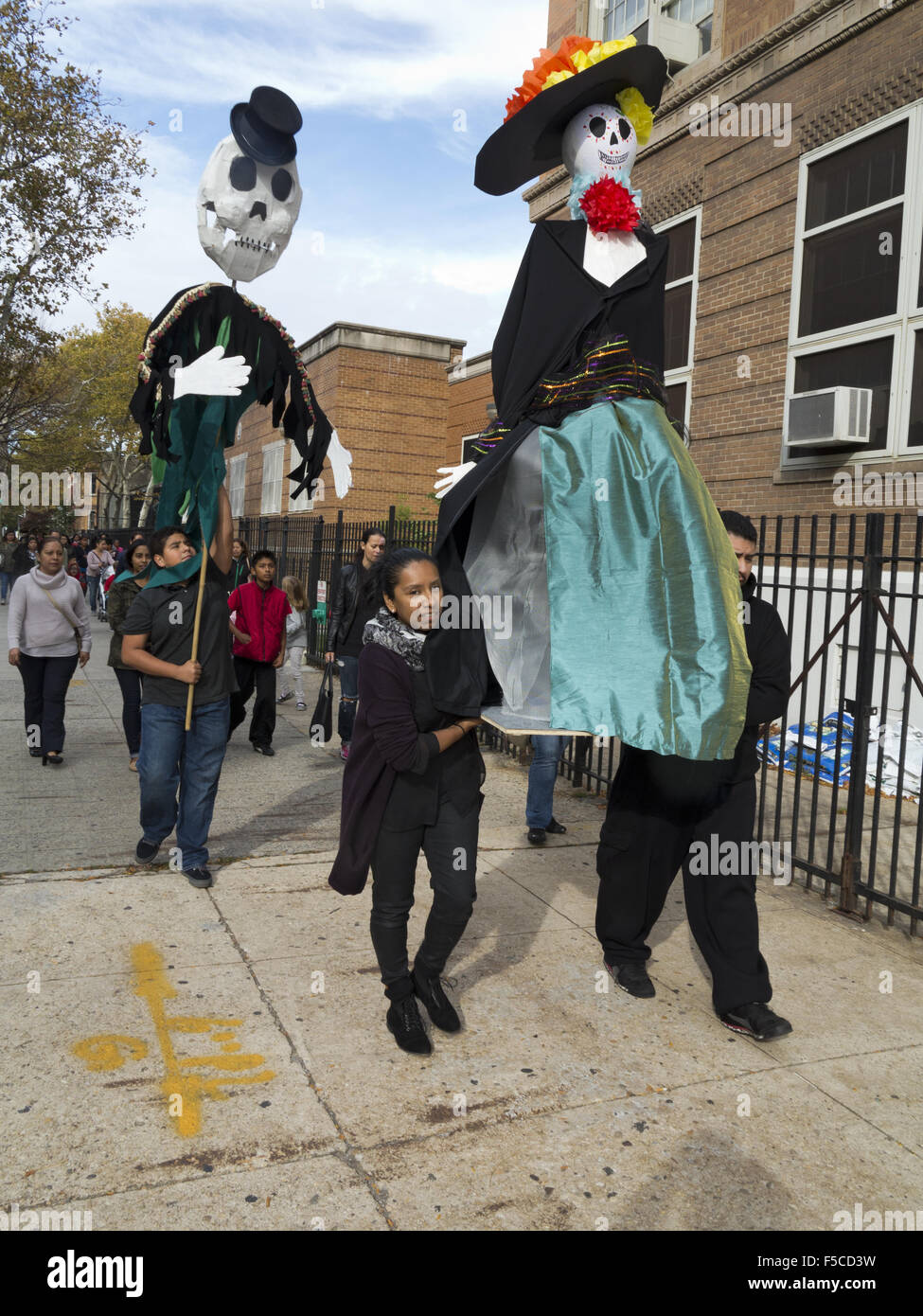 Giant puppets lead procession at Day of the Dead Festival in the Kensington section of Brooklyn, NY, Nov.1, 2015. Stock Photo