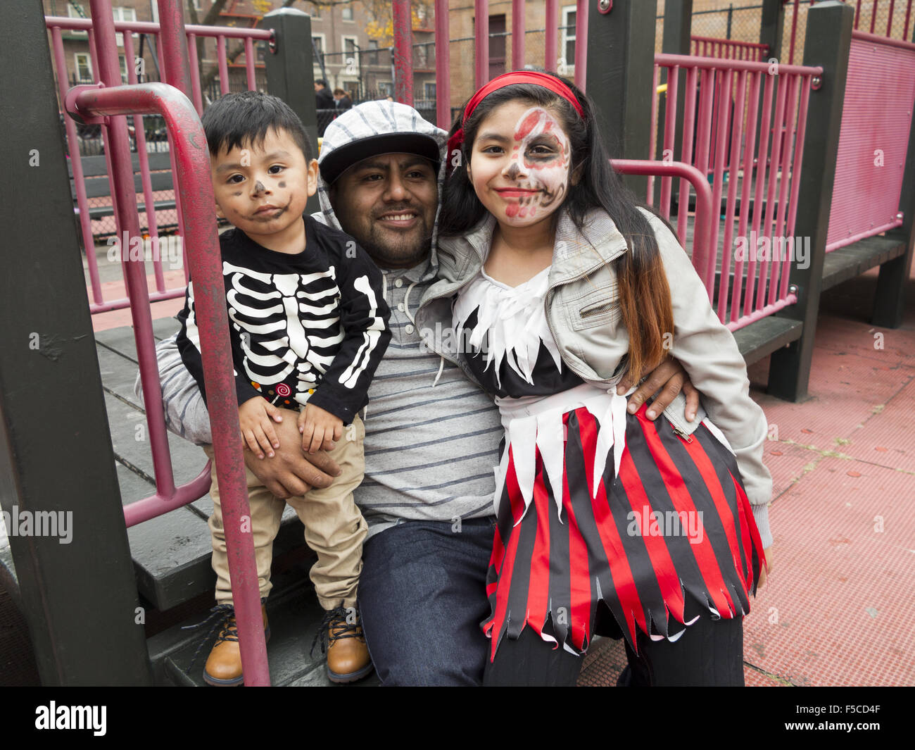 Proud father and his children at Day of the Dead Festival in Brooklyn, NY, Nov.1, 2015. Stock Photo