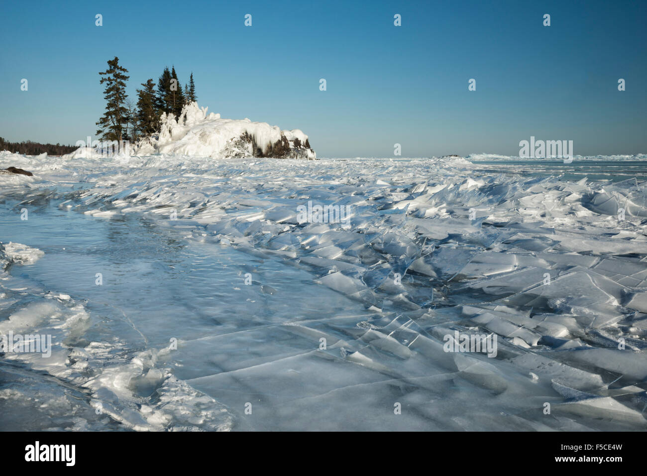 Tobolone Island on Lake Superior covered in winter snow and ice, Grand