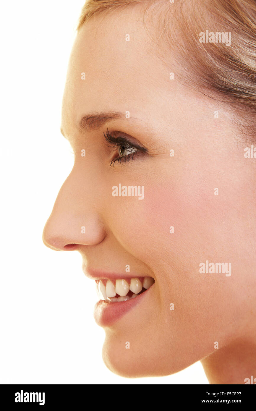 Young happy blonde woman in profile view Stock Photo