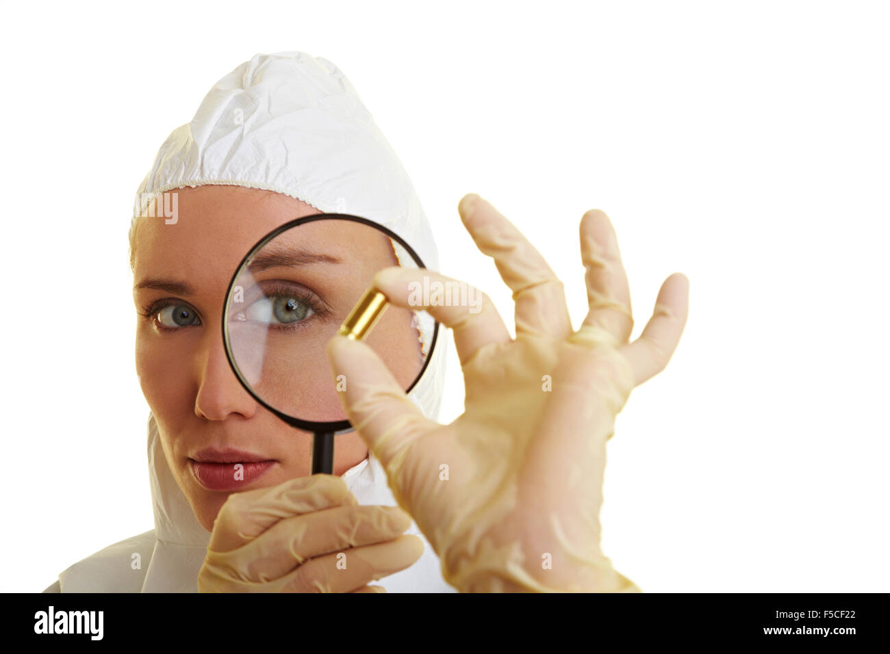 Female forensic scientist holding ammunition as evidence Stock Photo