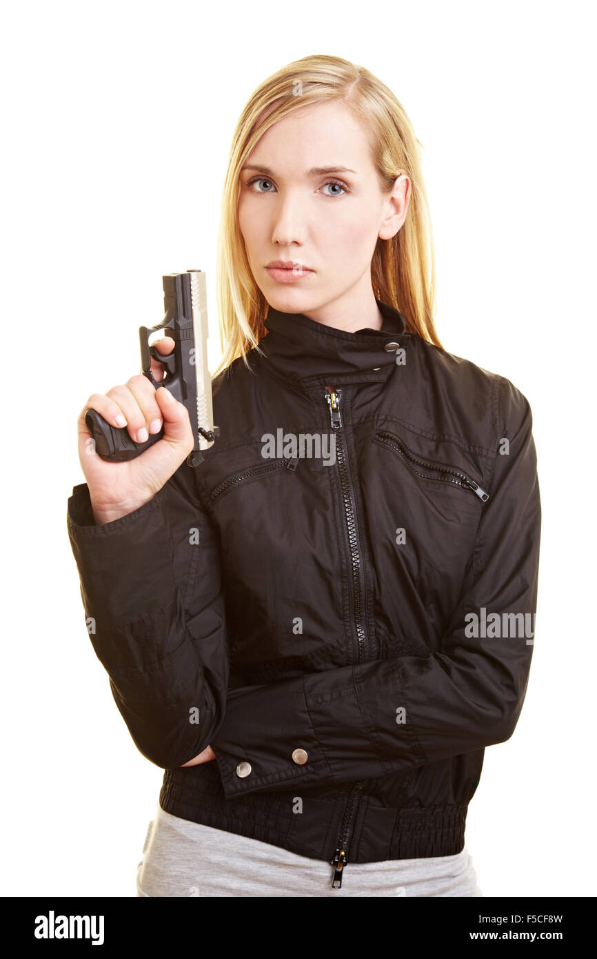 Young blonde woman holding a pistol in her hand Stock Photo