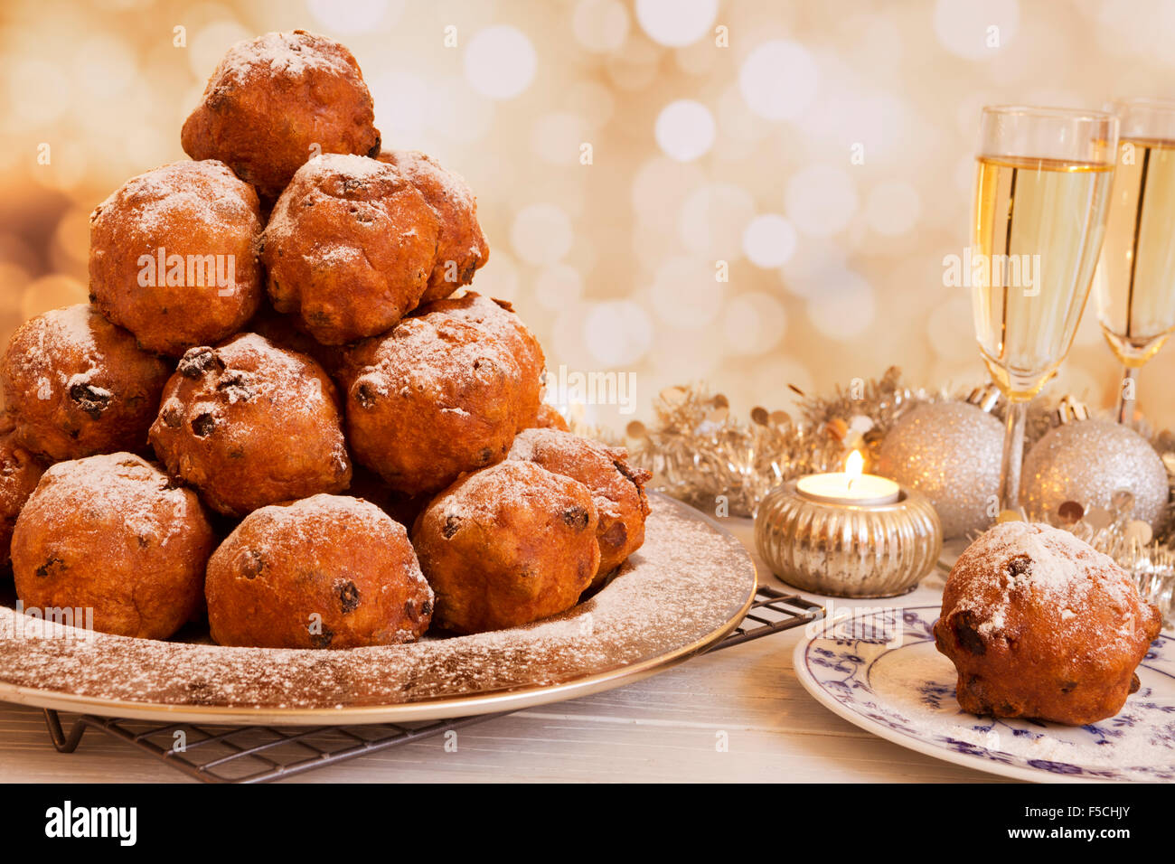 Champagne and 'Oliebollen', traditional Dutch pastry for New Year's Eve. Stock Photo
