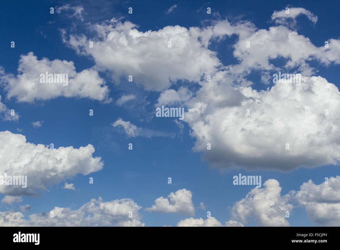 Thick white clouds with bright blue skies Stock Photo Alamy