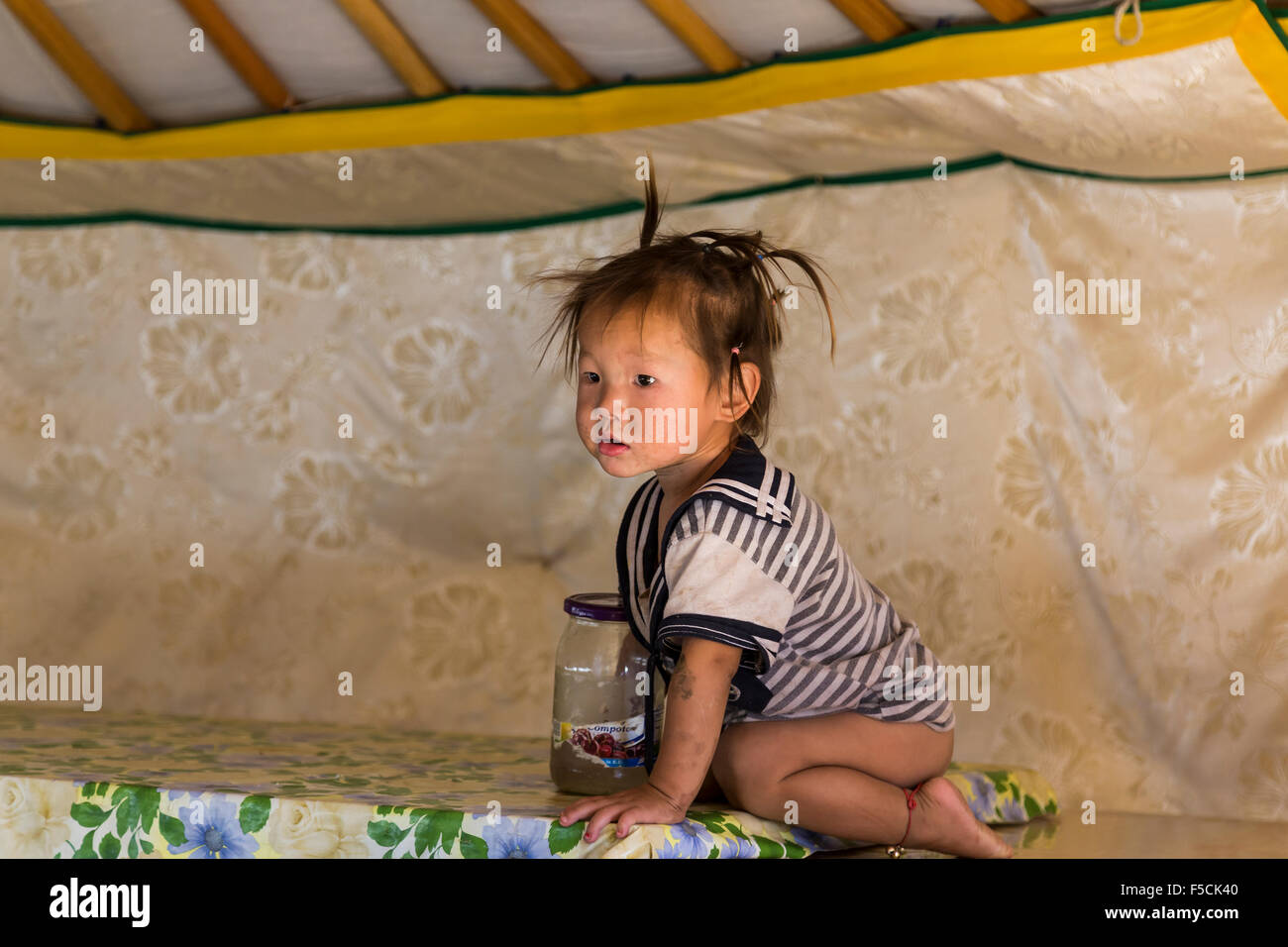 Mongolian kid in a Ger Stock Photo - Alamy