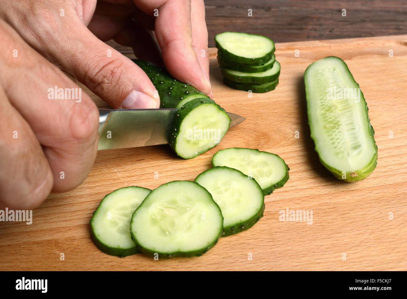 Slicing cucumbers Stock Photo Alamy