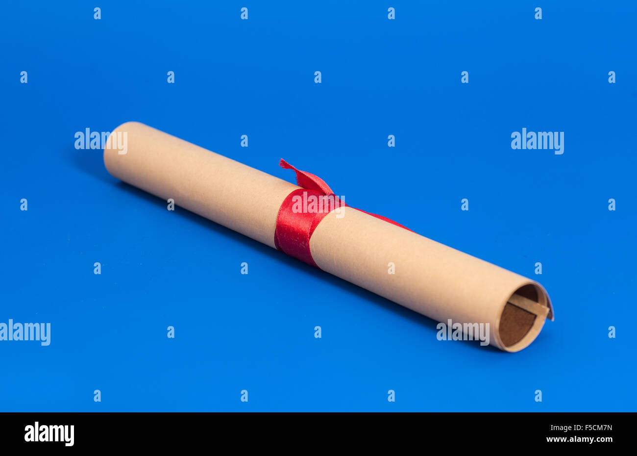 Diploma with Red Ribbon on blue background Stock Photo - Alamy