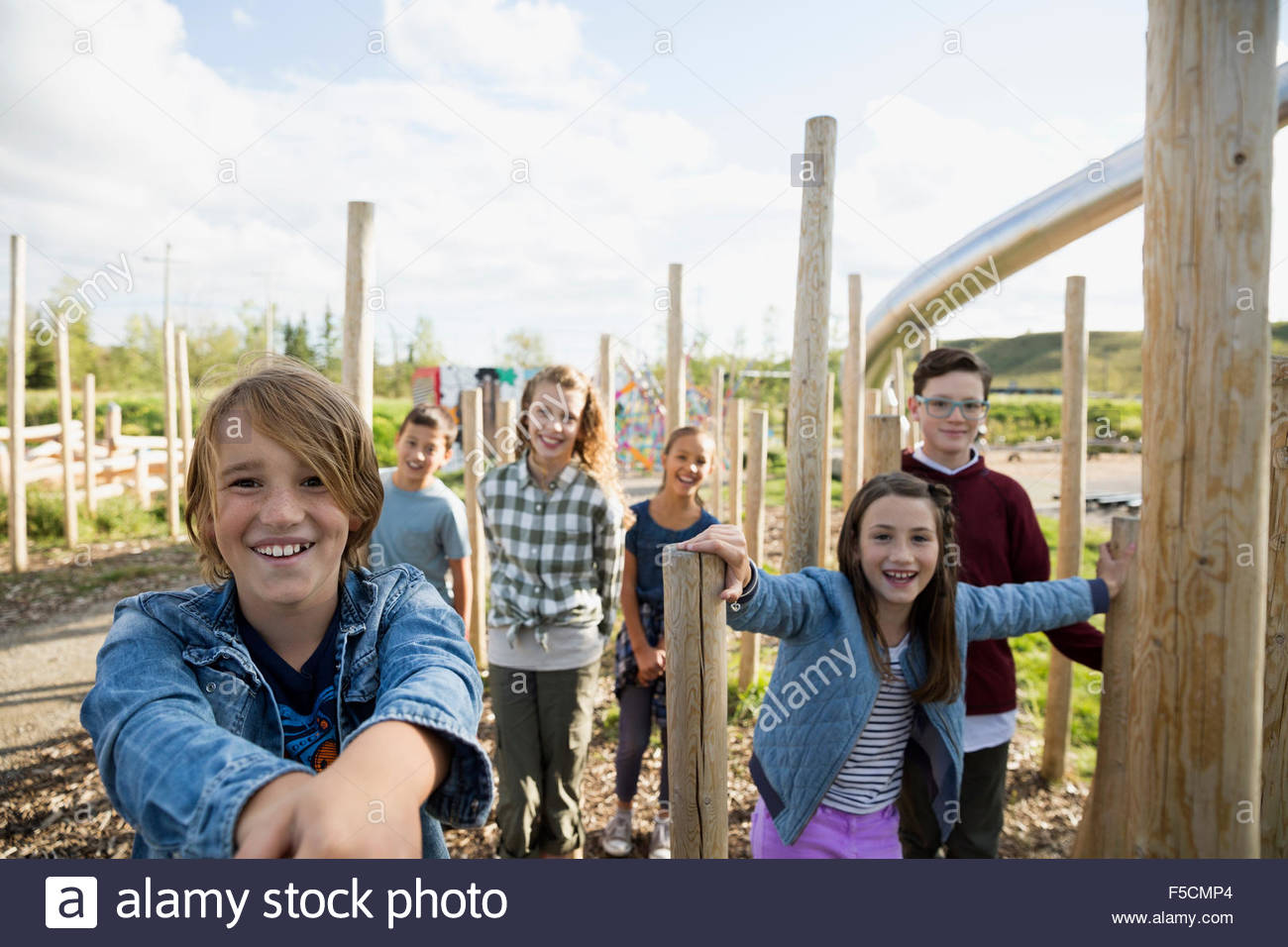 Portrait smiling kids at playground Stock Photo