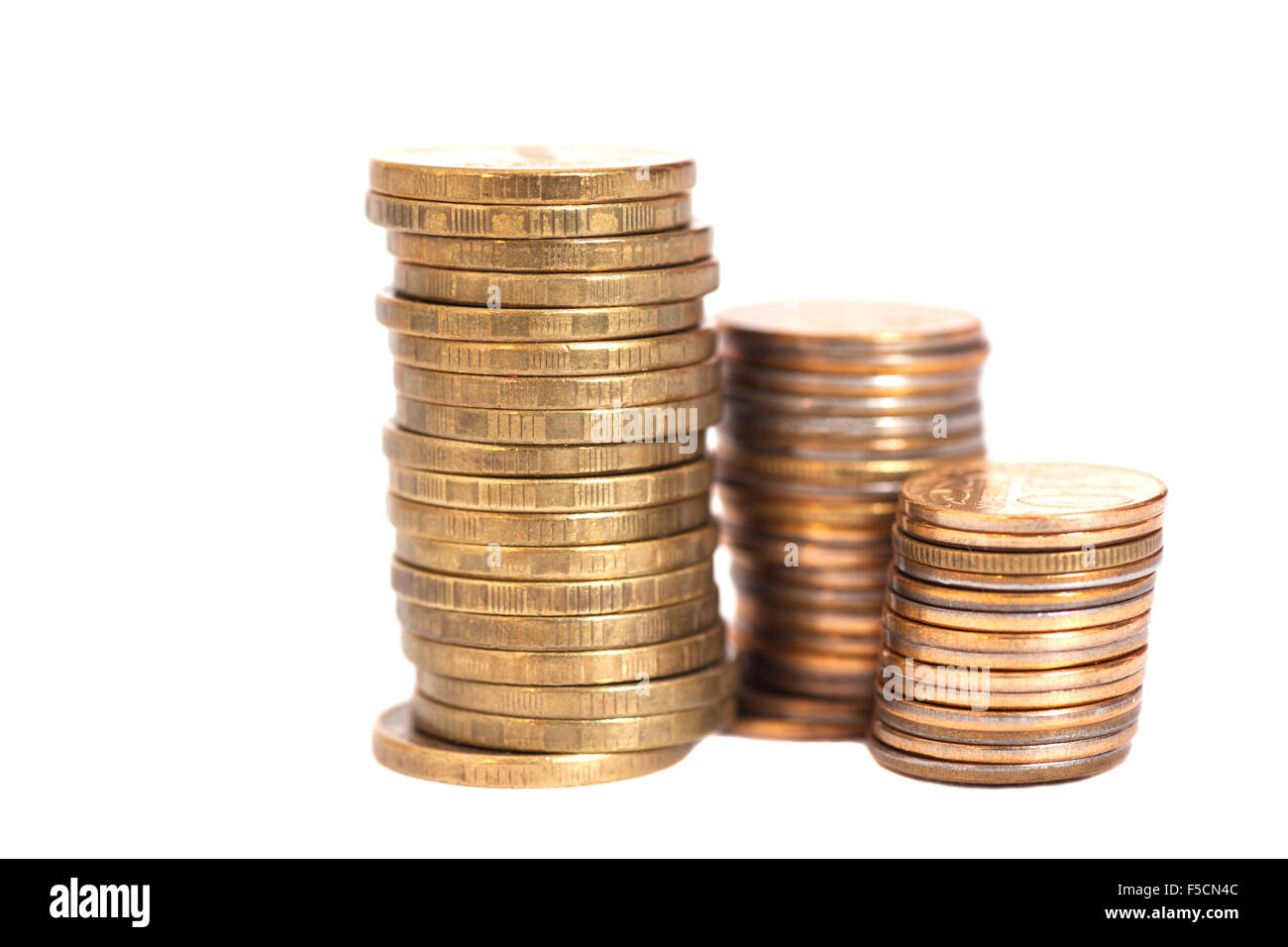 stacks of golden coins isolated on white Stock Photo - Alamy