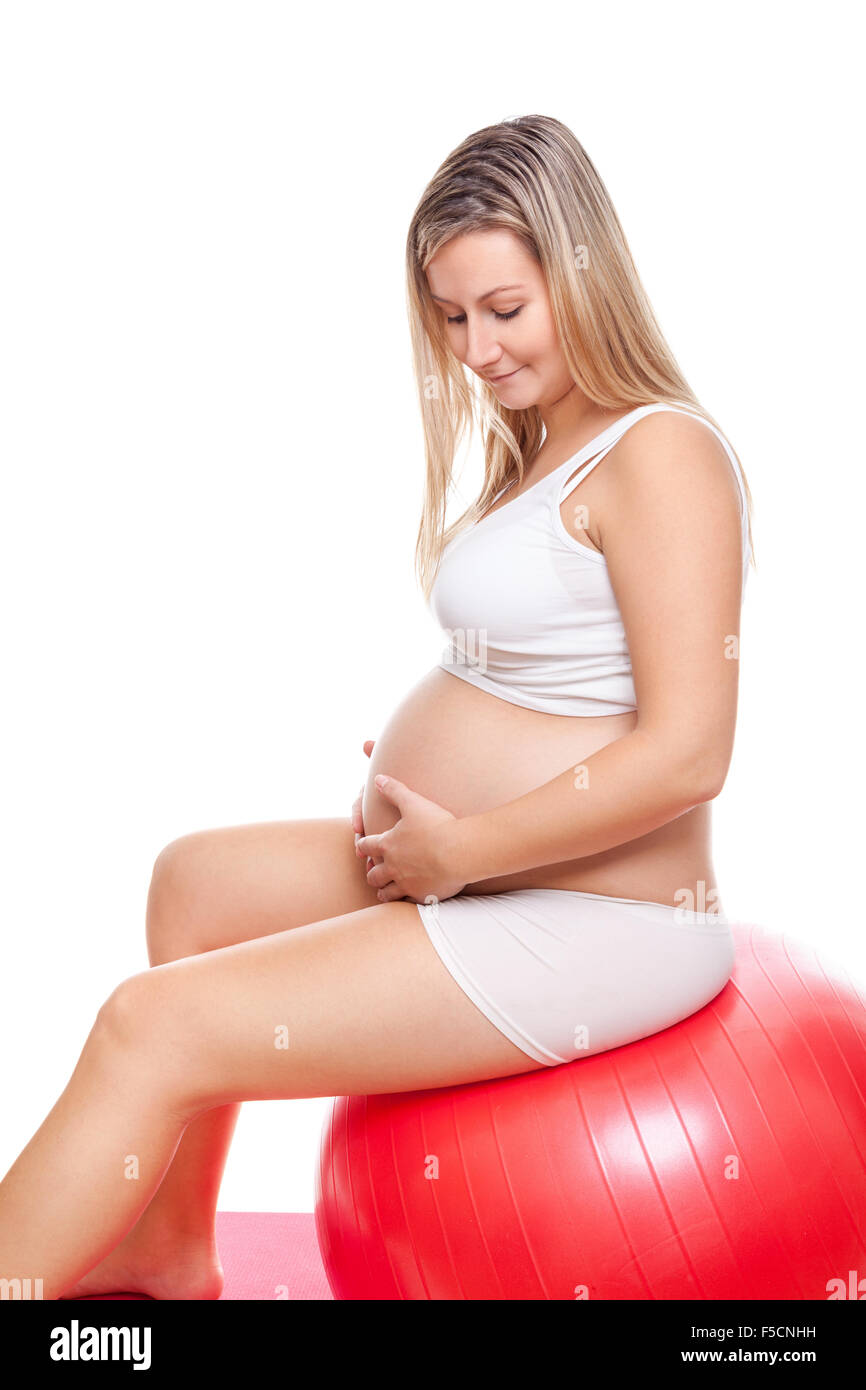Working out with fitness ball during pregnancy Stock Photo