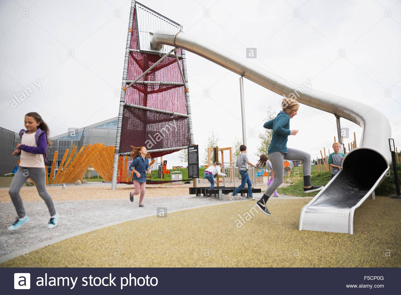 Kids playing at playground Stock Photo