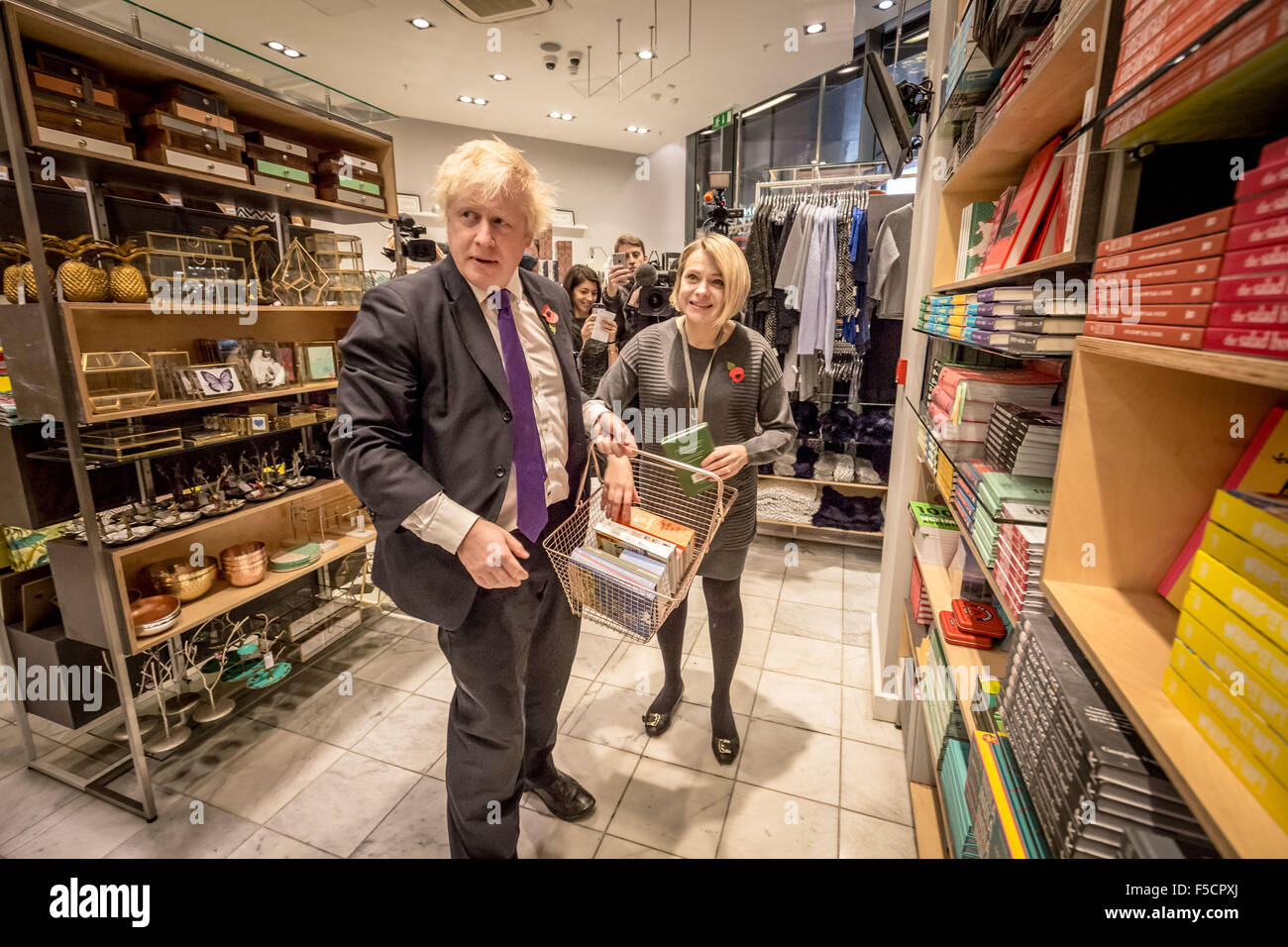 London, UK. 2nd November, 2015. Mayor Boris Johnson helps to serve