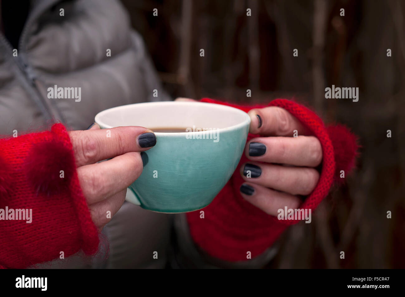 Female hands holding cup of hot coffee Stock Photo - Alamy