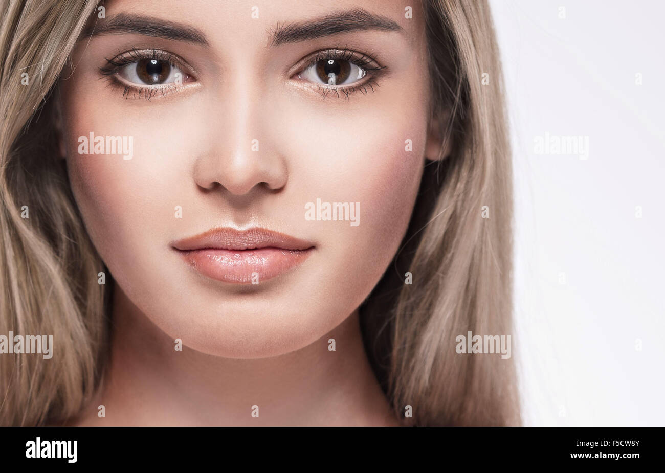 Young beautiful woman face portrait with healthy skin Stock Photo - Alamy