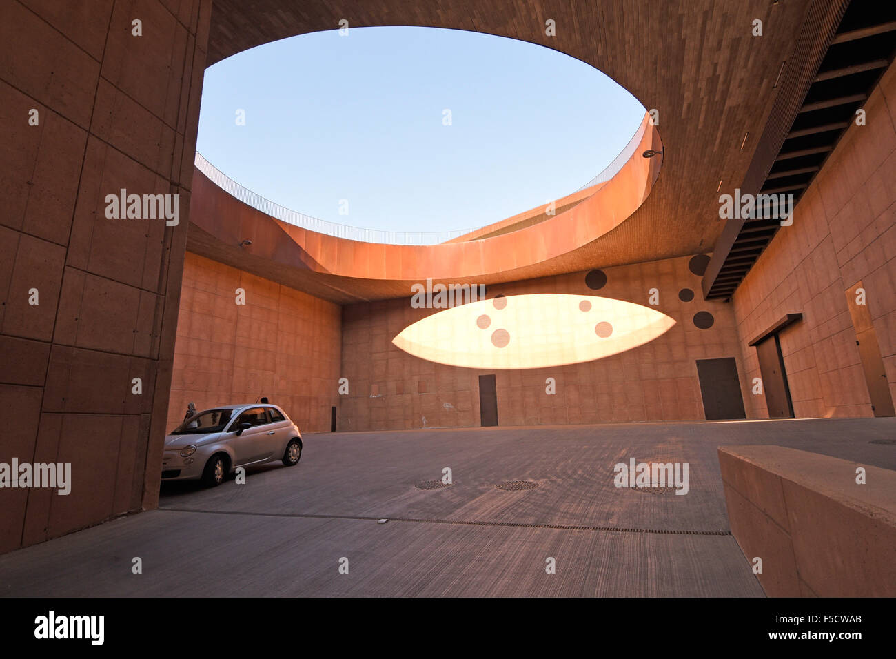 10.04.2015, San Casciano in Val di Pesa, Tuscany, Italy - On 25 October 2012, the Cantina del Chianti Classico (winery) of the Antinori family has been opened. A Schluesselpunkt the architecture should be the invisibility. So two slots cut into the land with vineyards in a large hill. In order to realize the harmony with the landscape, it was decided to cover the entire building with a vineyard. In earth tones brown-red, the winery was built from natural materials such as terracotta, corten steel and wood. The building includes except the winery nor the family museum and the wine sale. Photo:  Stock Photo