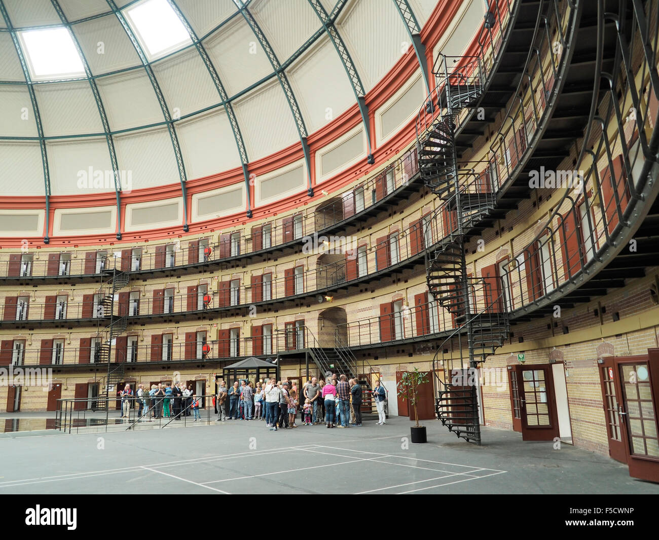 Interior of the round dome prison koepelgevangenis in Breda, the Netherlands, with people on a guided tour. Stock Photo