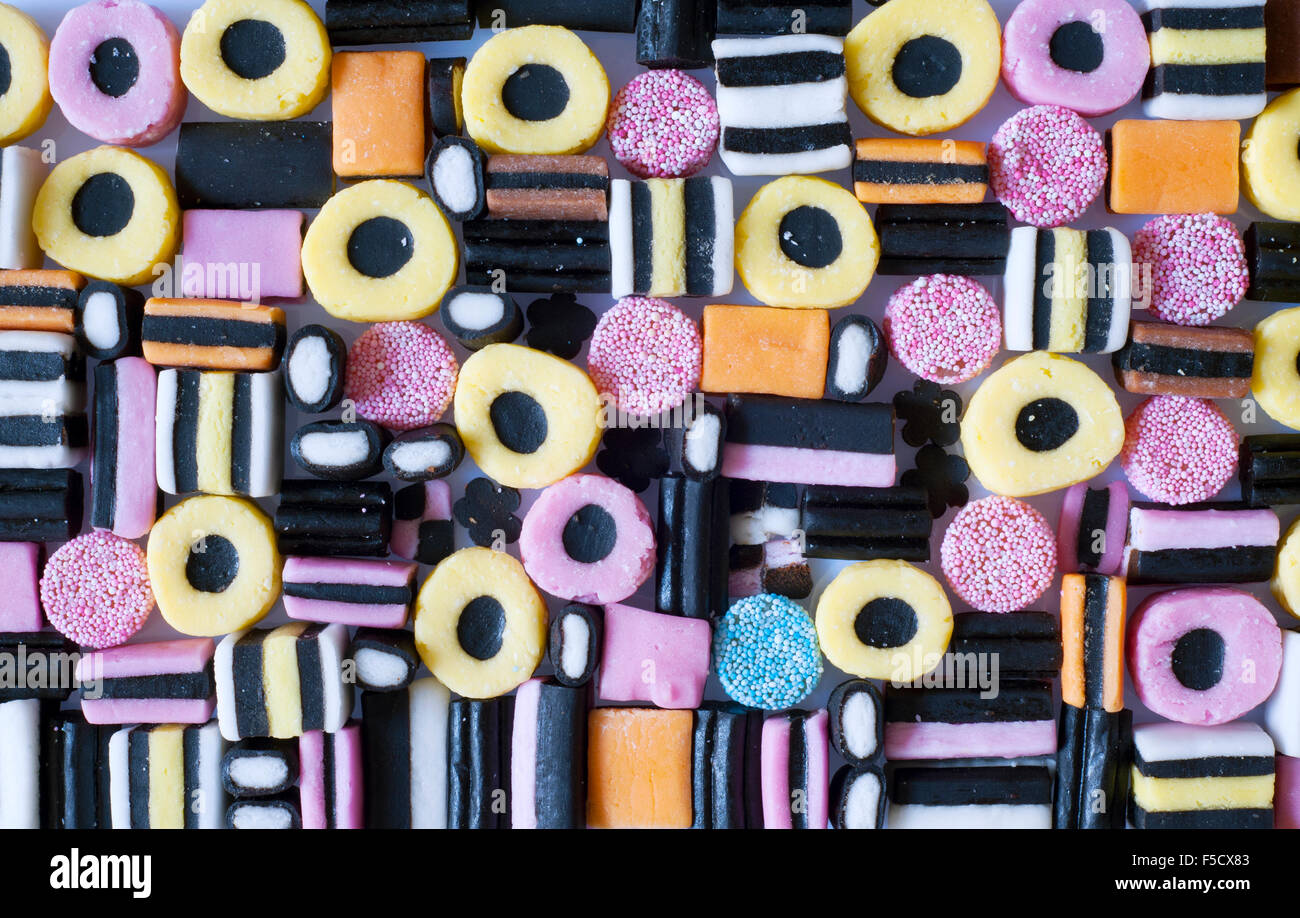 a colourful selection of licorice allsorts sweets on an off white background Stock Photo