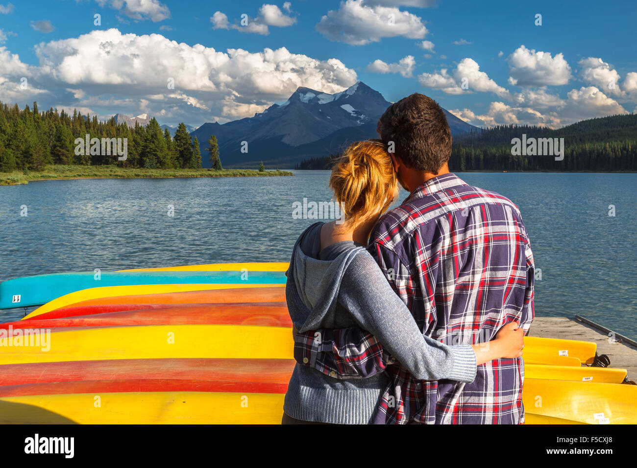 A couple by the boat house in Maligne Lake, Jasper National Park, Alberta, Canada, America. Stock Photo