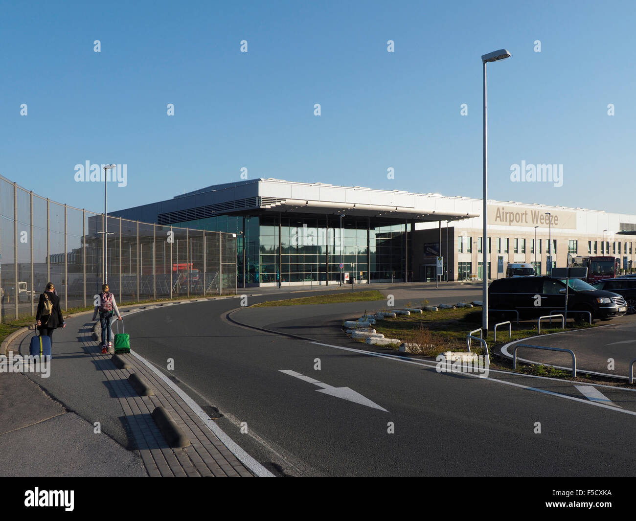 Weeze Niederrhein airport terminal exterior with travelers people Ryanair NRN Stock Photo