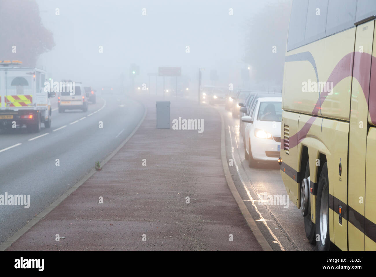 Nottingham, UK. 2nd November 2015. Monday morning commuter traffic is hit by dense fog. The Met Office issued a Yellow Warning of Fog and have reported that visibility will be poor and below 100m at times. Credit:  Martyn Williams/Alamy Live News Stock Photo