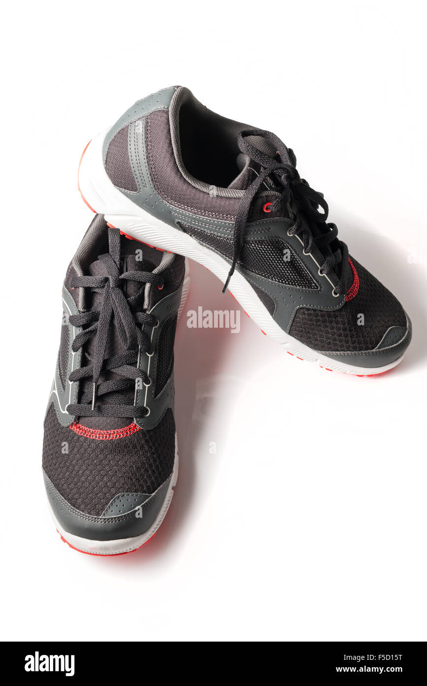 New unbranded running shoe color black and red, sneaker or trainer isolated on white background Stock Photo