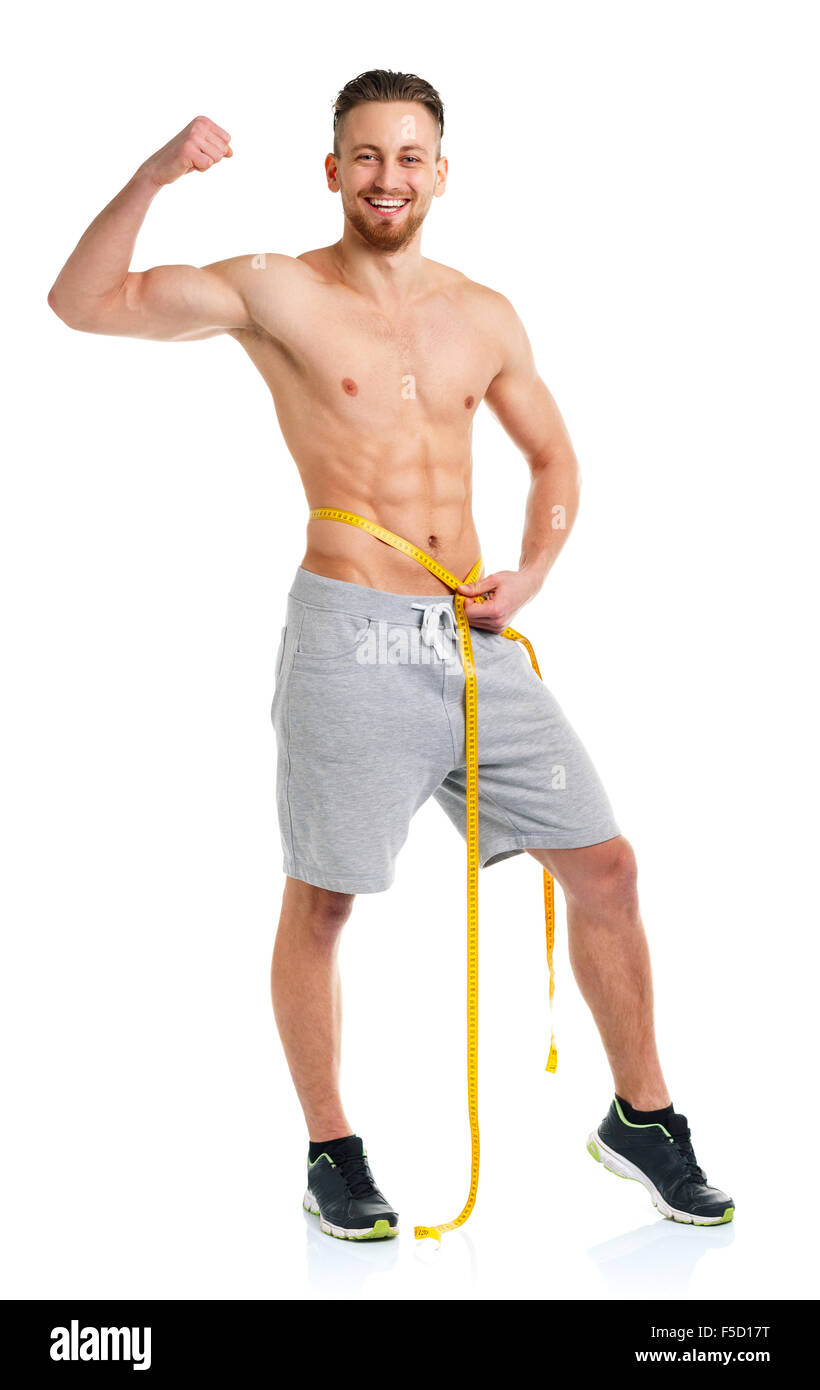 Athletic man with measuring tape on the white background Stock Photo