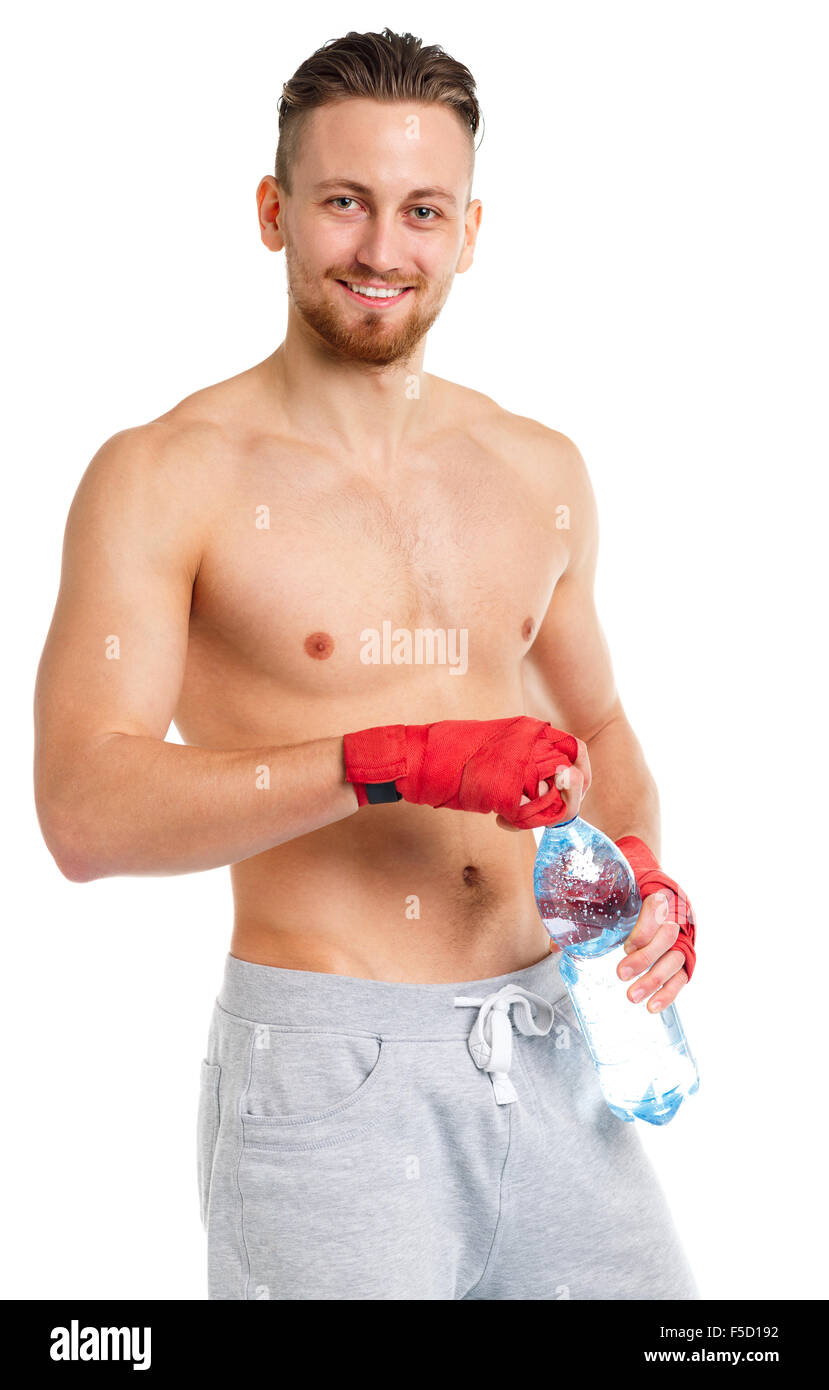 Sport attractive man wearing boxing bandages and drinking fresh water on the white Stock Photo