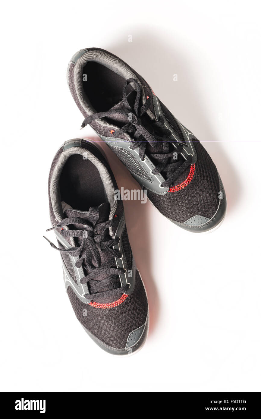 New unbranded running shoe color black and red, sneaker or trainer isolated on white background Stock Photo