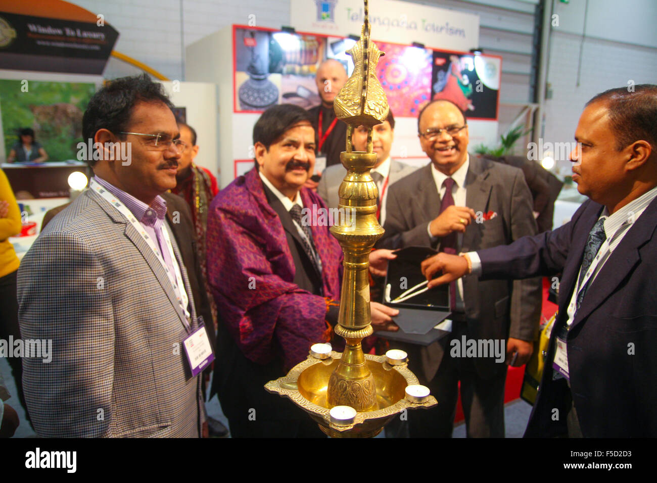 London, UK 2 November 2015. India Travel Secretary poses for photos after a candle lighting ceremony to open the Tourism stand at World Travel Market 2015. Credit:  david mbiyu/Alamy Live News Stock Photo