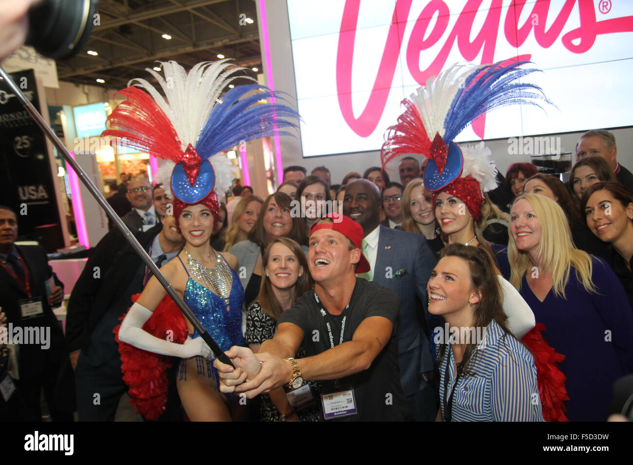 London, UK 2 November 2015. Made In Chelsea's Jamie Laing poses with members of the Las Vegas exhibition stand for a selfie photoshoot at the World Travel Market 2015. Credit:  david mbiyu/Alamy Live News Stock Photo