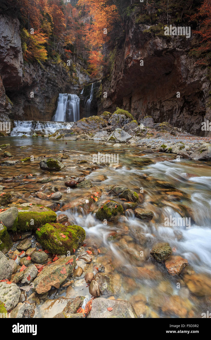 unspoiled waterfall with autumn colors Stock Photo