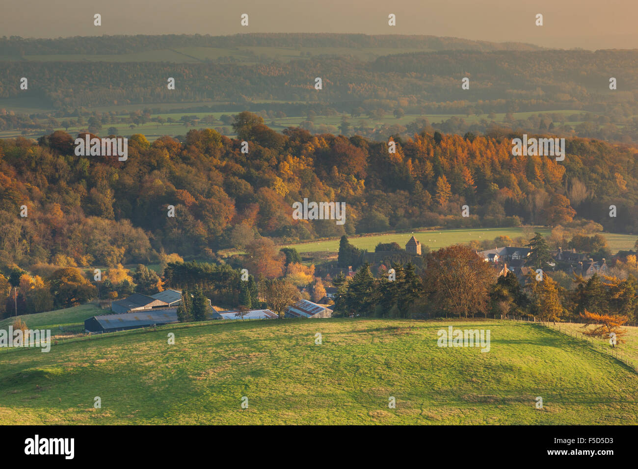 The village of Hope Bowdler in autumnal countryside as seen from the lower slopes of Hope Bowdler Hill, Church Stretton, Salop Stock Photo