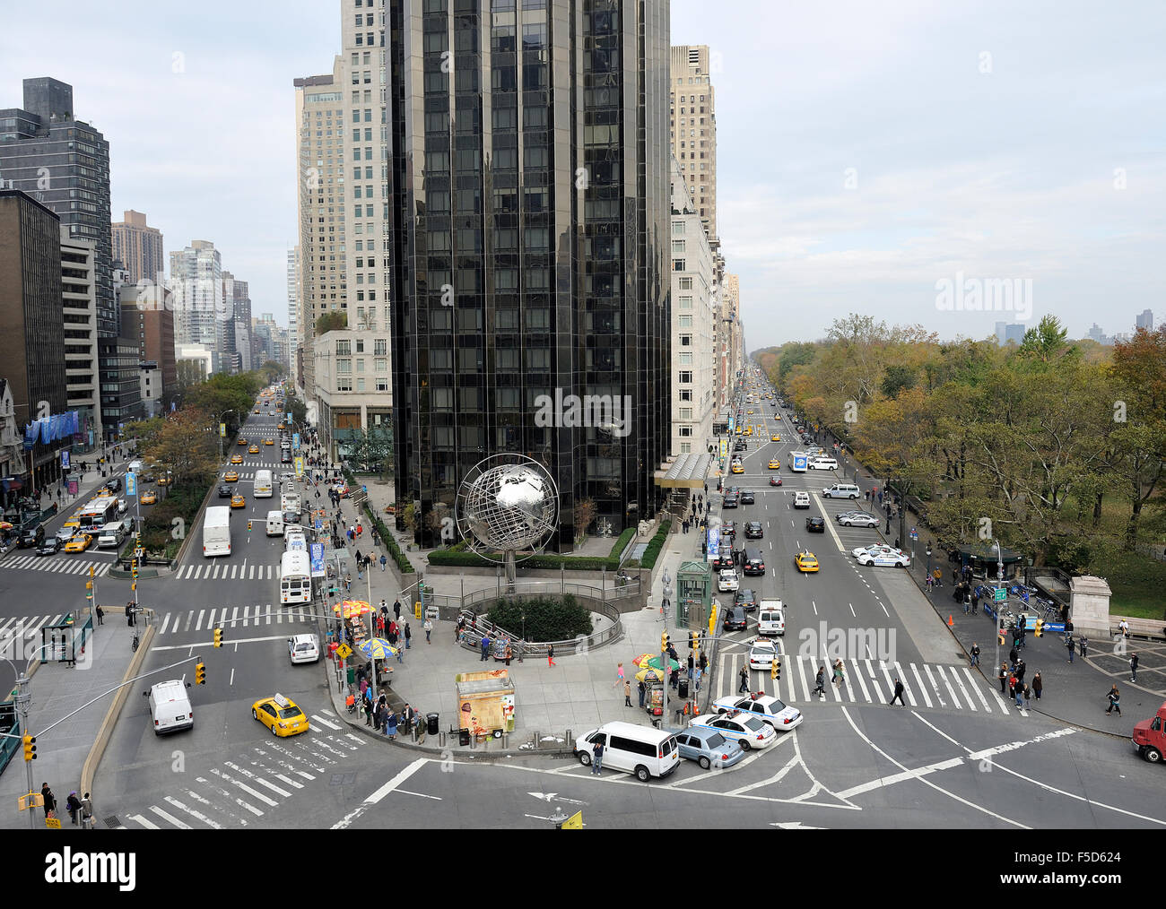 View at Columbus Circle in N.Y. near Central Park.With taxis and globe in front of the Trump Tower. Stock Photo