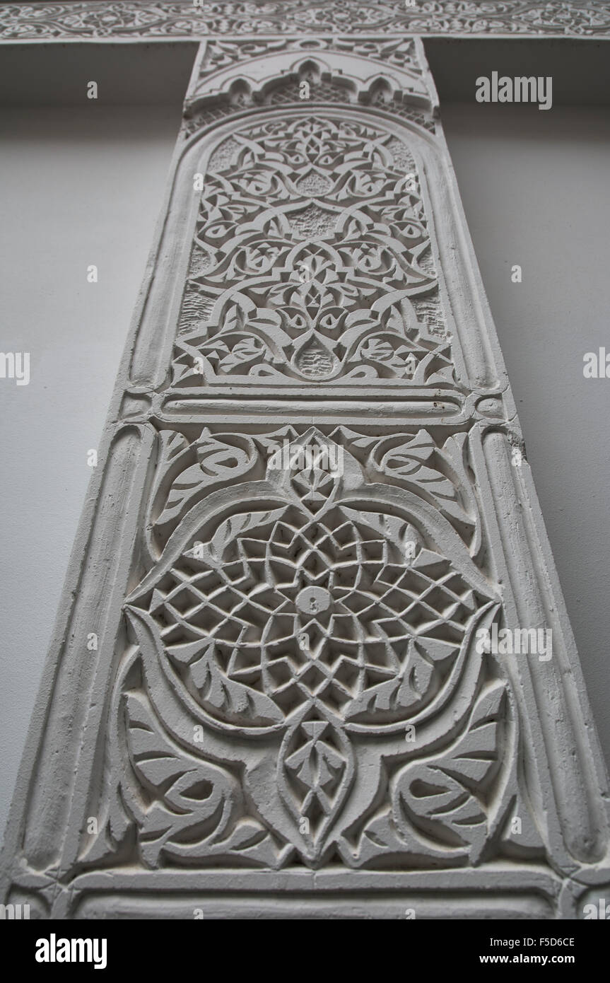 Typical Moroccan style designs and patterns adorn the ceiling and walls of the Riad. Stock Photo