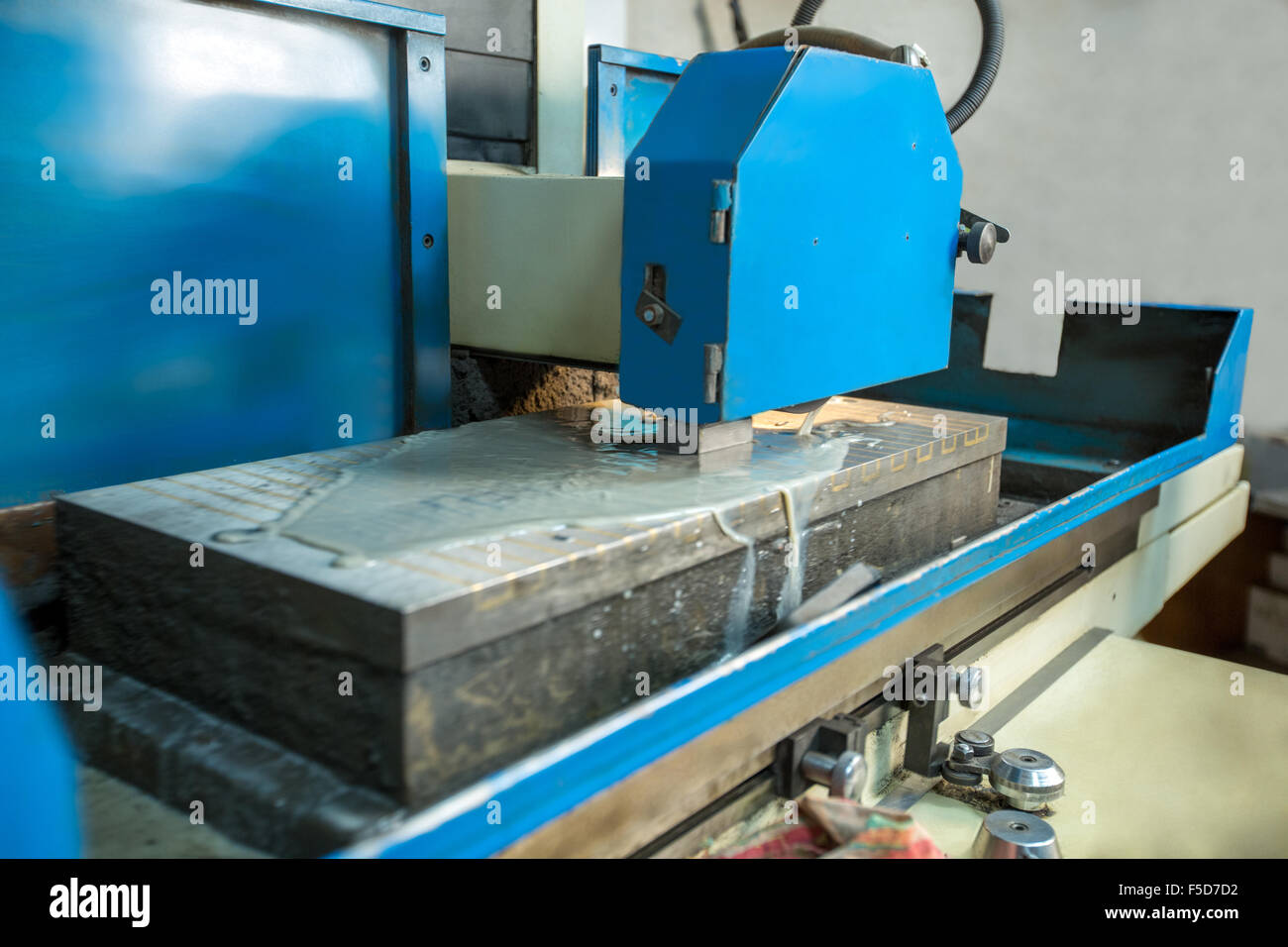 Production department. Image of grinding machine Stock Photo - Alamy