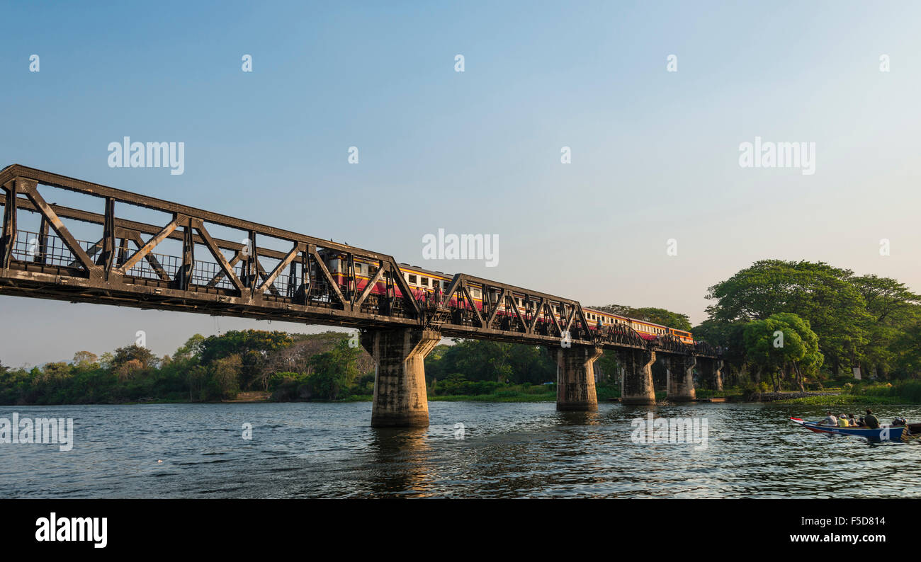 Train crossing historical River Kwai Bridge, route from Thailand to Burma, Death Railway, Kanchanaburi Province Stock Photo