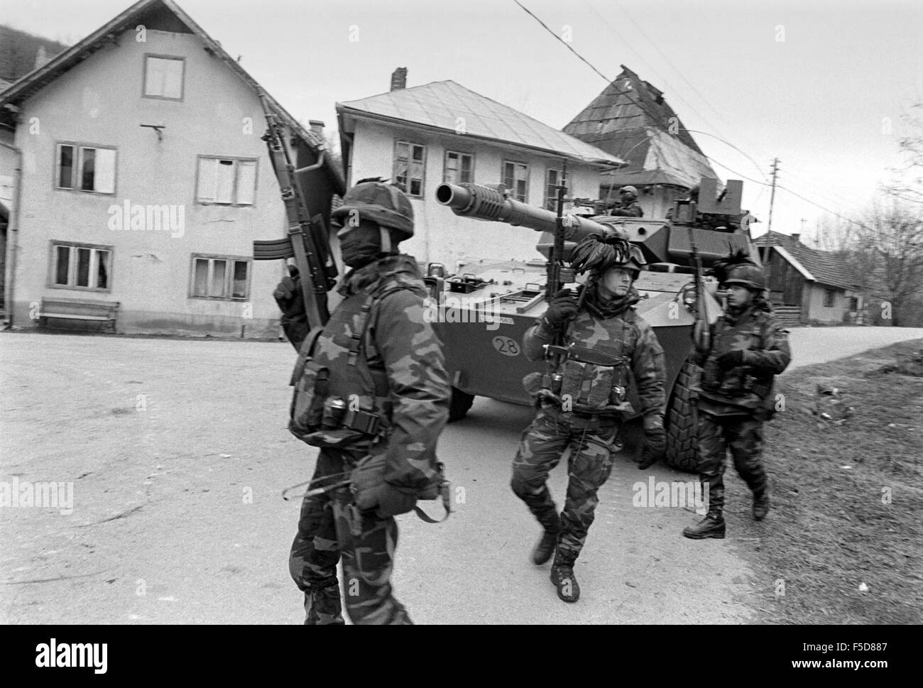 NATO intervention in Bosnia-Herzegovina after Dayton Accords, Italian Army soldiers, patrolling road near Sarajevo, January 1996 Stock Photo