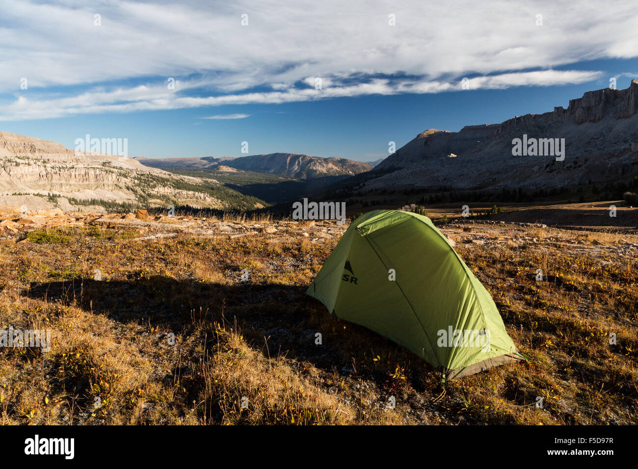 A tent set up in a large basin among Gros Ventre Peaks, Gros Ventre Wilderness, Wyoming Stock Photo