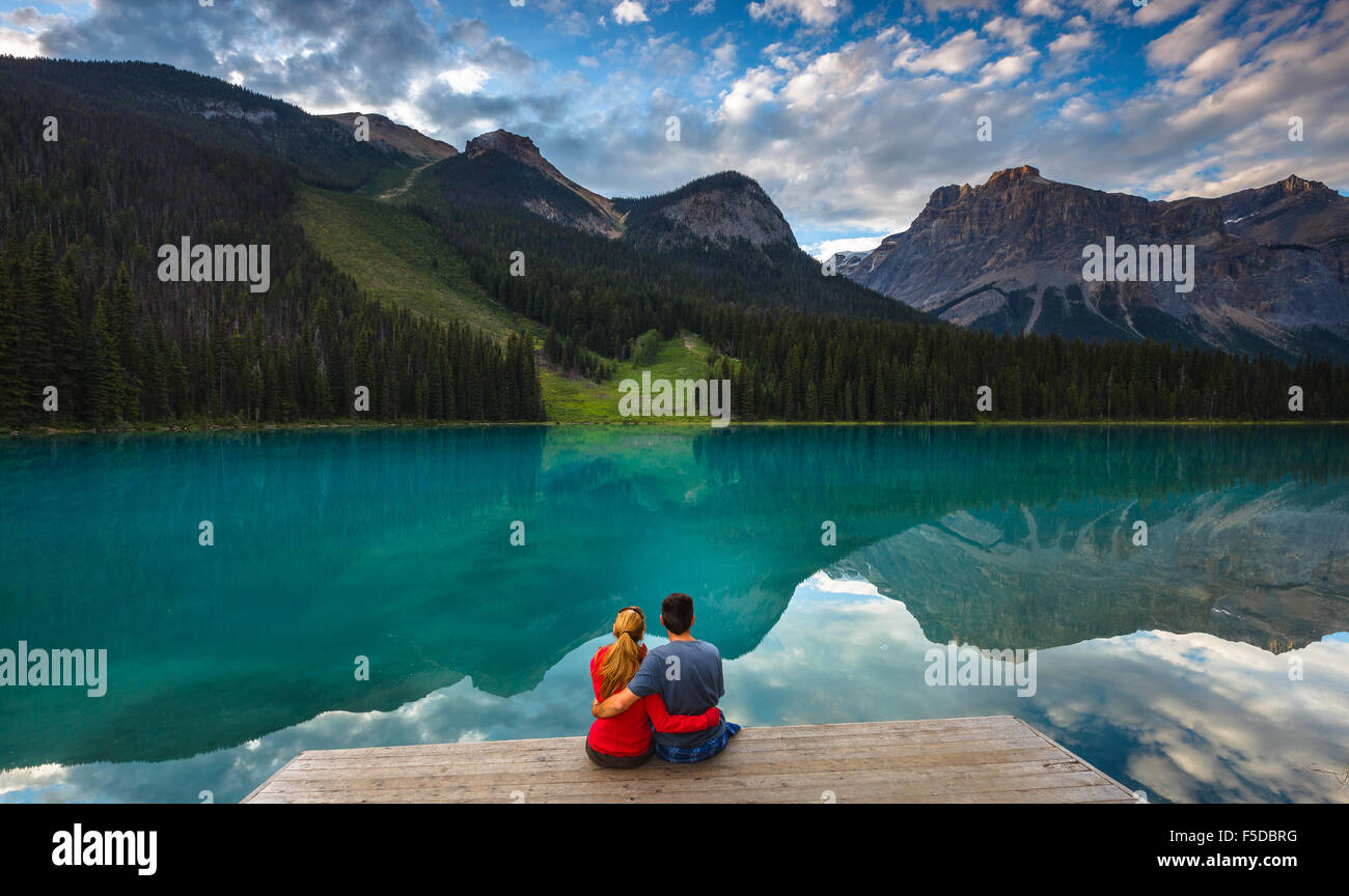A young couple by beautiful Emerald Lake in Yoho National Park, British Columbia, Canada, America. Stock Photo