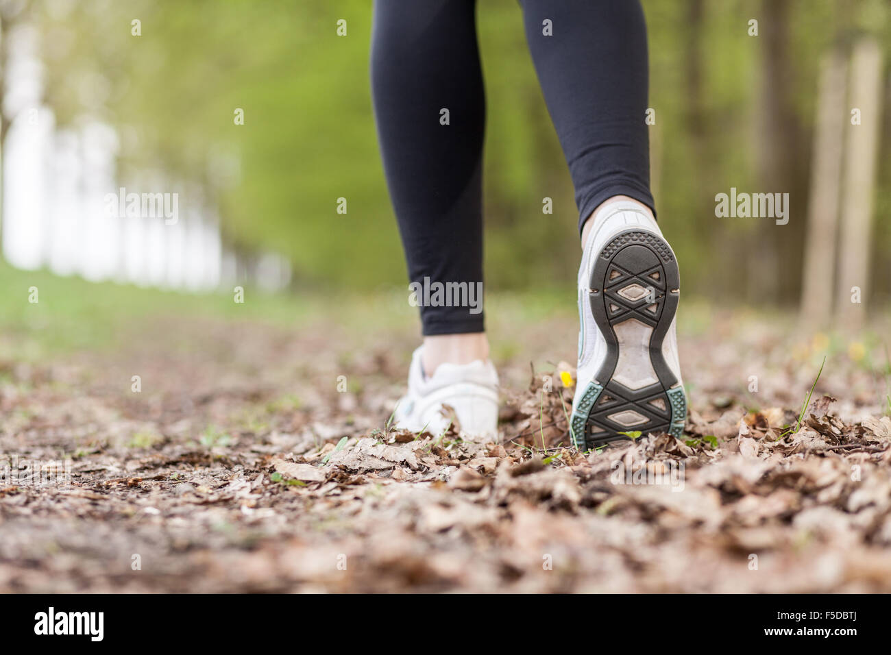 Feet of a running woman Stock Photo Alamy