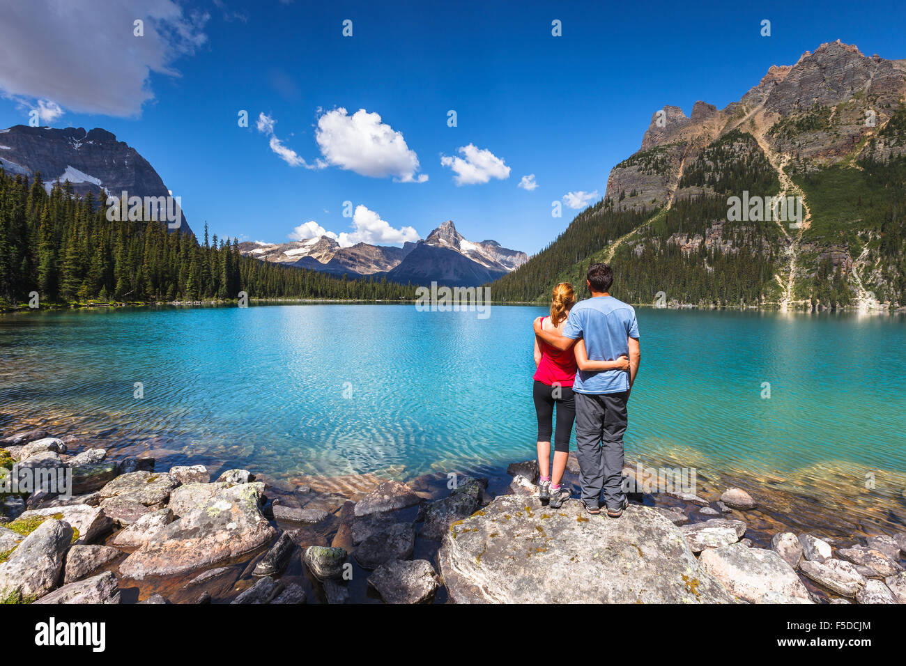 A young couple by beautiful Lake O'Hara in Yoho National Park, British Columbia, Canada, America. Stock Photo