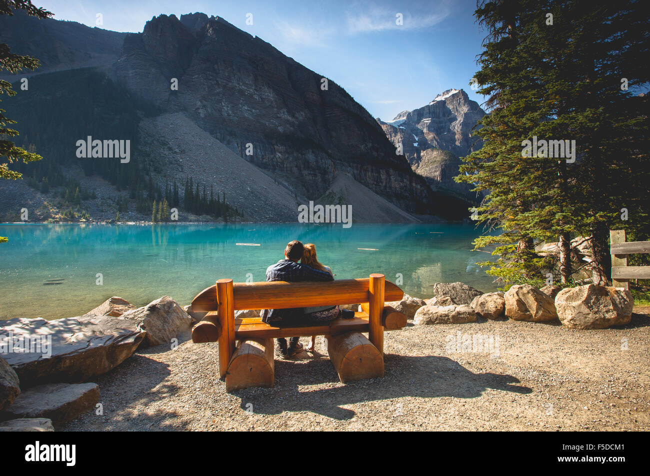 A couple admiring Moraine Lake, Banff National Park, Alberta, Canada, America. Stock Photo