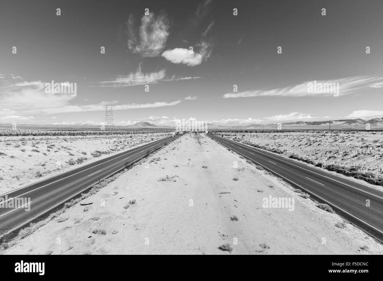 Interstate 15 between Los Angeles and Las Vegas in California's Mojave Desert black and white. Stock Photo