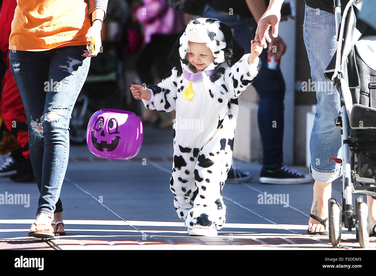 Oct. 31, 2015 - Napa, CA, U.S. - Dressed as a dalmation, eighteen month old Ava Brown trick or treats with her family on First street during the Hometown Halloween in downtown Napa on Saturday. (Credit Image: © Napa Valley Register via ZUMA Wire) Stock Photo