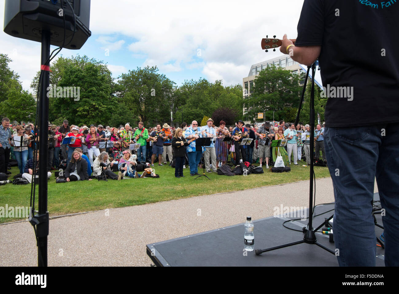 People playing ukuleles at the Big Busk, part of the Ukulele Festival
