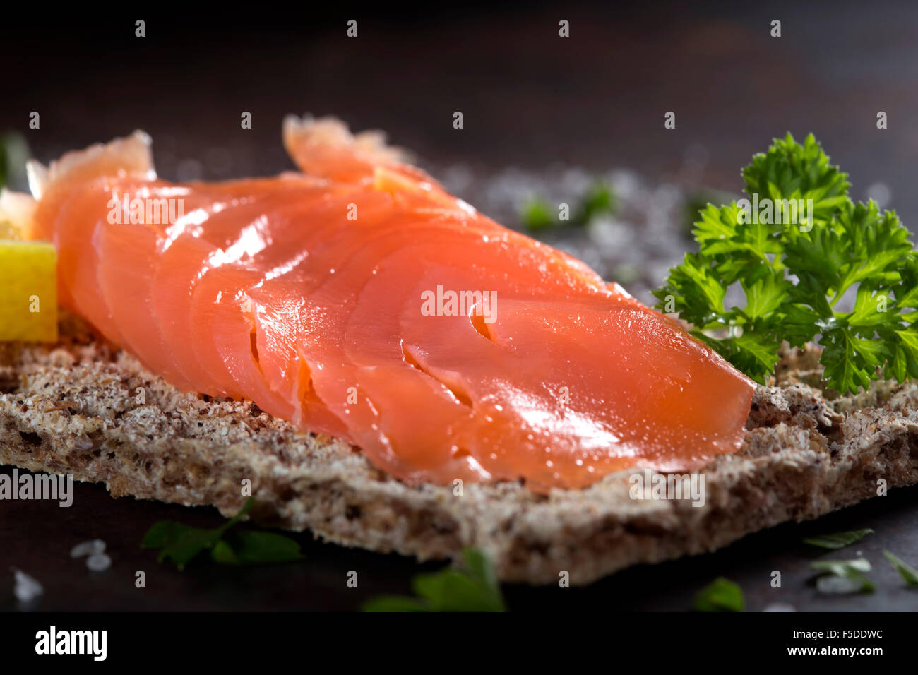 Close-up of smoked salmon served with crackers Stock Photo